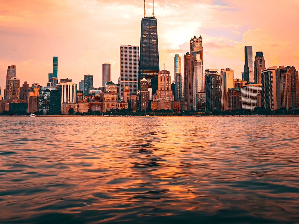 The Chicago skyline at golden hour across the lake.